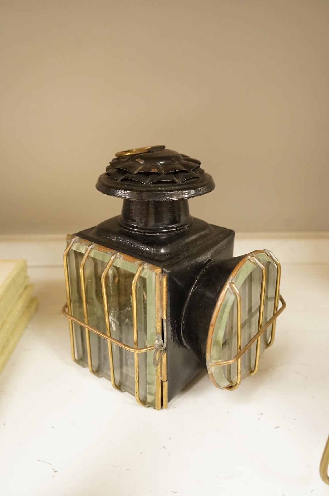 A railway lamp, a vintage Eccles Protector miners lamp and another, largest 17cm high